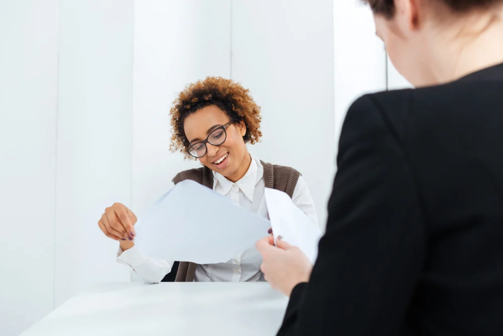 A candidate and interviewer discussing an opportunity