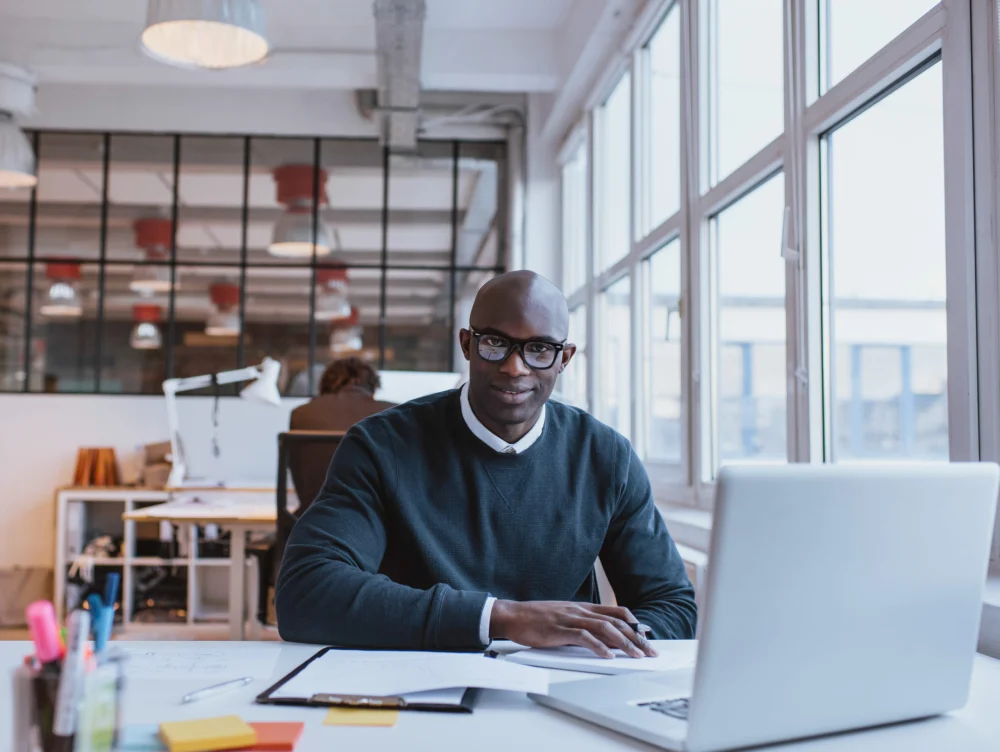 A professional working with digital tools in a modern office